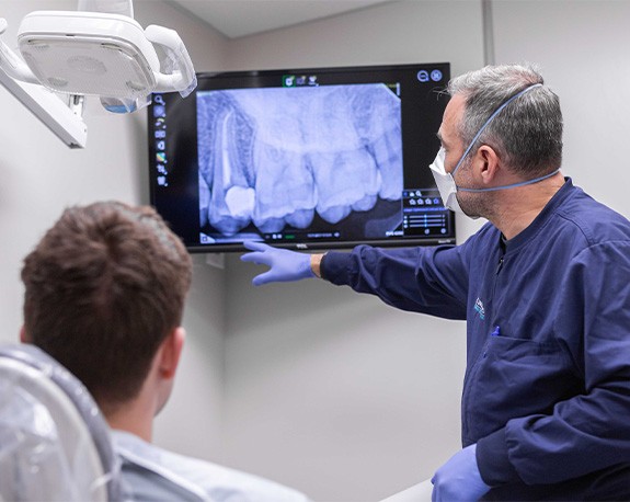 Young woman smiling right before root canal treatment