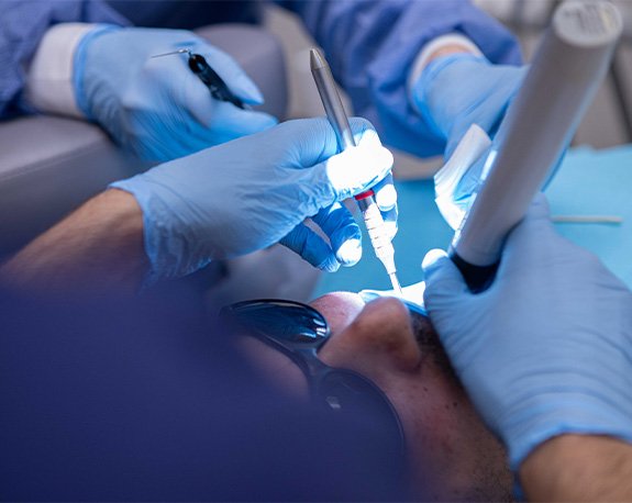 Model of tooth showing the root canals and nerves inside of it